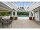 A view of the pool with pergola featuring a shaded seating area, offering a resort-like experience at 8402 Loggers Run, North Charleston, SC 29420