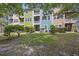 Townhome rear view featuring balconies and lush greenery offering privacy and outdoor living at 9019 Parlor Dr, Ladson, SC 29456