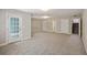 Finished basement area with neutral carpet, a walkout entrance, and plenty of space at 9019 Parlor Dr, Ladson, SC 29456
