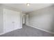 Bright bedroom featuring neutral walls, plush carpet and double door closet at 9019 Parlor Dr, Ladson, SC 29456