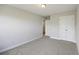 Neutral bedroom features plush carpet, a double-door closet, and an ensuite entry at 9019 Parlor Dr, Ladson, SC 29456