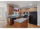 This renovated kitchen has an island, stainless appliances, granite countertops, and lots of storage at 9019 Parlor Dr, Ladson, SC 29456