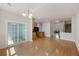 Open-concept dining and kitchen area with a sliding glass door and hardwood flooring at 9019 Parlor Dr, Ladson, SC 29456