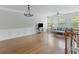 Open living space showcasing hardwood floors, modern decor, and abundant natural light at 9019 Parlor Dr, Ladson, SC 29456