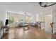 Inviting living room with hardwood floors, comfortable seating, and a staircase view at 9019 Parlor Dr, Ladson, SC 29456