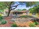 Expansive backyard with mature trees, a brick house, and a screened-in porch at 924 Trent St, Charleston, SC 29414