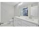 Modern bathroom features dual vanity sinks, white cabinets, and a blue tiled shower at 924 Trent St, Charleston, SC 29414