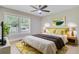 Bright bedroom featuring a large window, stylish decor, and warm lighting, perfect for a relaxing retreat at 924 Trent St, Charleston, SC 29414