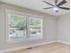 Bright bedroom showcasing large windows with tranquil neighborhood views and neutral wall colors at 924 Trent St, Charleston, SC 29414