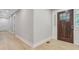 Welcoming entryway featuring a beautiful wooden front door and hardwood floors at 924 Trent St, Charleston, SC 29414
