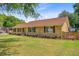 Well-maintained one-story brick home with mature landscaping and a lush green lawn at 924 Trent St, Charleston, SC 29414