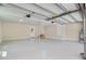 Spacious garage with epoxy flooring, storage space, and a modern overhead door system at 924 Trent St, Charleston, SC 29414