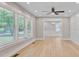 Sunlit living room featuring new floors, crisp white walls, and large windows offering an airy and open feel at 924 Trent St, Charleston, SC 29414