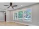 Bright living room featuring large windows, modern light fixtures, and fresh flooring, offering a clean look at 924 Trent St, Charleston, SC 29414