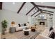 Bright living room with vaulted ceilings, wood beams, a fireplace, and built-in shelving for a cozy atmosphere at 924 Trent St, Charleston, SC 29414