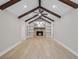 Spacious living room showcasing a stone fireplace with exposed beams and recessed lighting at 924 Trent St, Charleston, SC 29414