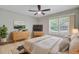 Serene bedroom with neutral tones, modern furniture, and natural light from a large window at 924 Trent St, Charleston, SC 29414