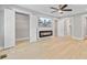 Spacious bedroom boasts a closet, an electric fireplace with wall-mounted TV, and ensuite bathroom at 924 Trent St, Charleston, SC 29414