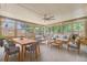 Bright sunroom with ample seating, a ceiling fan, and natural light streaming through large windows at 924 Trent St, Charleston, SC 29414