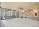 Elegant sunroom with white floors, brick accents, large windows, and modern ceiling fan at 924 Trent St, Charleston, SC 29414