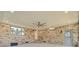 Modern sunroom with brick accents, sleek ceiling fan, recessed lighting, and a cooling unit at 924 Trent St, Charleston, SC 29414