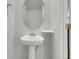 Bathroom featuring pedestal sink, modern mirror and shelves at 9998 Winged Elm St, Ladson, SC 29456