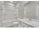 Bright bathroom featuring a shower-tub combo, sleek vanity, and neutral color palette at 9998 Winged Elm St, Ladson, SC 29456