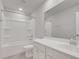 Bright bathroom featuring a shower-tub combo, sleek vanity, and neutral color palette at 9998 Winged Elm St, Ladson, SC 29456