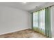 Bright, empty bedroom with natural light and hardwood flooring at 9998 Winged Elm St, Ladson, SC 29456
