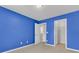 Bright blue bedroom featuring plush carpet and ample closet space at 9998 Winged Elm St, Ladson, SC 29456