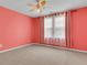 Cozy bedroom features a ceiling fan and plenty of natural light from the large window at 9998 Winged Elm St, Ladson, SC 29456