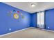 Blue bedroom with themed wall decorations, carpet and plenty of natural light at 9998 Winged Elm St, Ladson, SC 29456