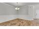 Empty dining room with wainscoting and chandelier at 9998 Winged Elm St, Ladson, SC 29456