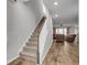 Entryway leading to living room with staircase and hardwood flooring at 9998 Winged Elm St, Ladson, SC 29456