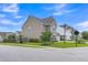 Corner lot showcasing home's side and back with neutral siding, landscaping, and street view at 9998 Winged Elm St, Ladson, SC 29456