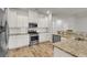 Well-equipped kitchen featuring granite countertops, stainless steel appliances, and ample cabinet space at 9998 Winged Elm St, Ladson, SC 29456