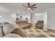 Open-concept living area with a spacious layout, comfortable seating, and seamless flow to the kitchen at 9998 Winged Elm St, Ladson, SC 29456