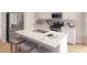 Modern kitchen featuring stainless steel appliances, granite countertops, and a kitchen island with bar seating at 1013 Swamp Rose Run, Summerville, SC 29485