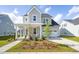Charming two-story home with a landscaped yard and inviting front porch at 104 Snow St, Summerville, SC 29486