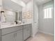 Elegant bathroom featuring double sinks, quartz countertops, gray cabinets, and tile flooring at 105 Indigo Cove Blvd, Summerville, SC 29486