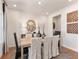 Elegant dining room with wood table, seating for six, stylish decor, and hardwood floors at 105 Indigo Cove Blvd, Summerville, SC 29486