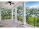 Open-air back porch with picturesque waterfront views, stylish tilework, and a ceiling fan for comfort at 108 Fairbanks Oak Aly # 201, Charleston, SC 29492