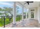 Covered back porch with decorative tilework offers an elegant outdoor space and scenic views at 108 Fairbanks Oak Aly # 201, Charleston, SC 29492