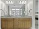 Bright bathroom featuring double vanity, granite countertop, and large mirror at 108 Fairbanks Oak Aly # 201, Charleston, SC 29492