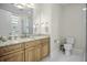 Well-lit bathroom with marble floors, granite vanity and glass shower at 108 Fairbanks Oak Aly # 201, Charleston, SC 29492
