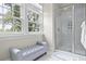 Bathroom featuring a glass shower, window, and bench seat at 108 Fairbanks Oak Aly # 201, Charleston, SC 29492
