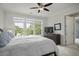 Bedroom with a large window offering outside views and ceiling fan at 108 Fairbanks Oak Aly # 201, Charleston, SC 29492