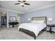 Bedroom featuring a tufted headboard, ceiling fan, and neutral color palette at 108 Fairbanks Oak Aly # 201, Charleston, SC 29492