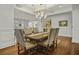 Formal dining room with decorative chairs, dark wood table, and decorative ceiling at 108 Fairbanks Oak Aly # 201, Charleston, SC 29492