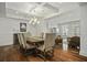 This dining room boasts hardwood floors, a coffered ceiling, and plenty of natural light at 108 Fairbanks Oak Aly # 201, Charleston, SC 29492